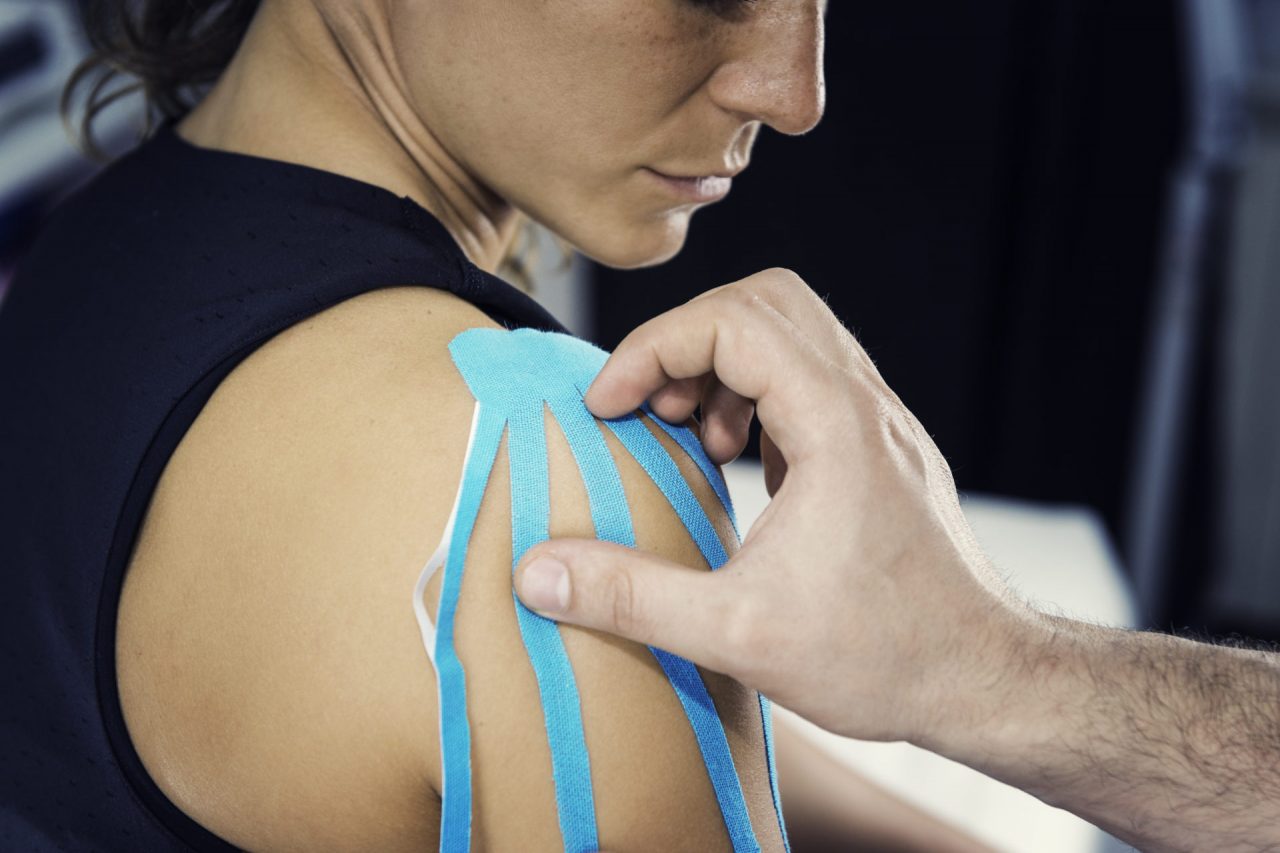Therapeutic treatment of shoulder with kinesio tape